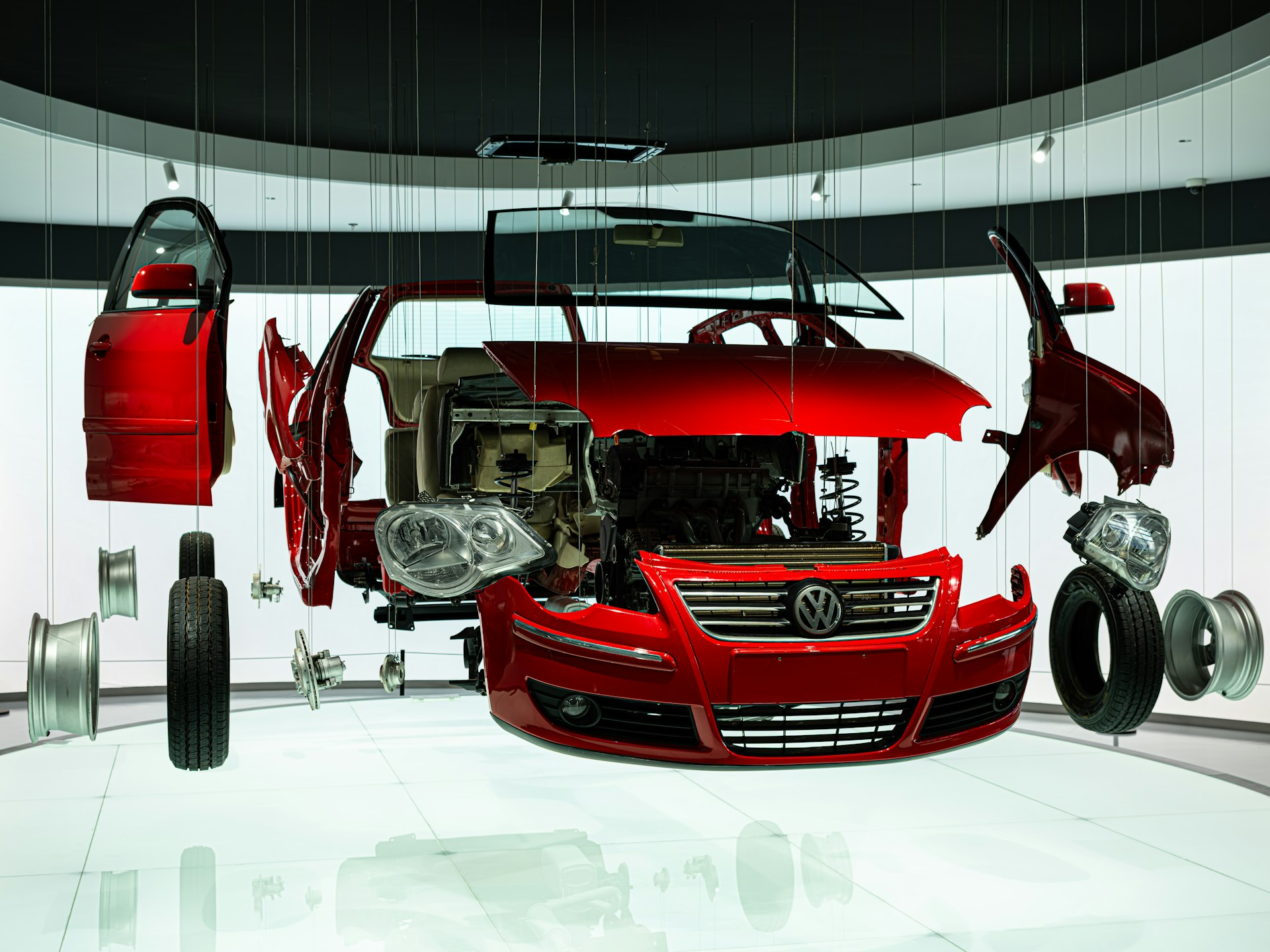 Exploded view of a red volkswagen car